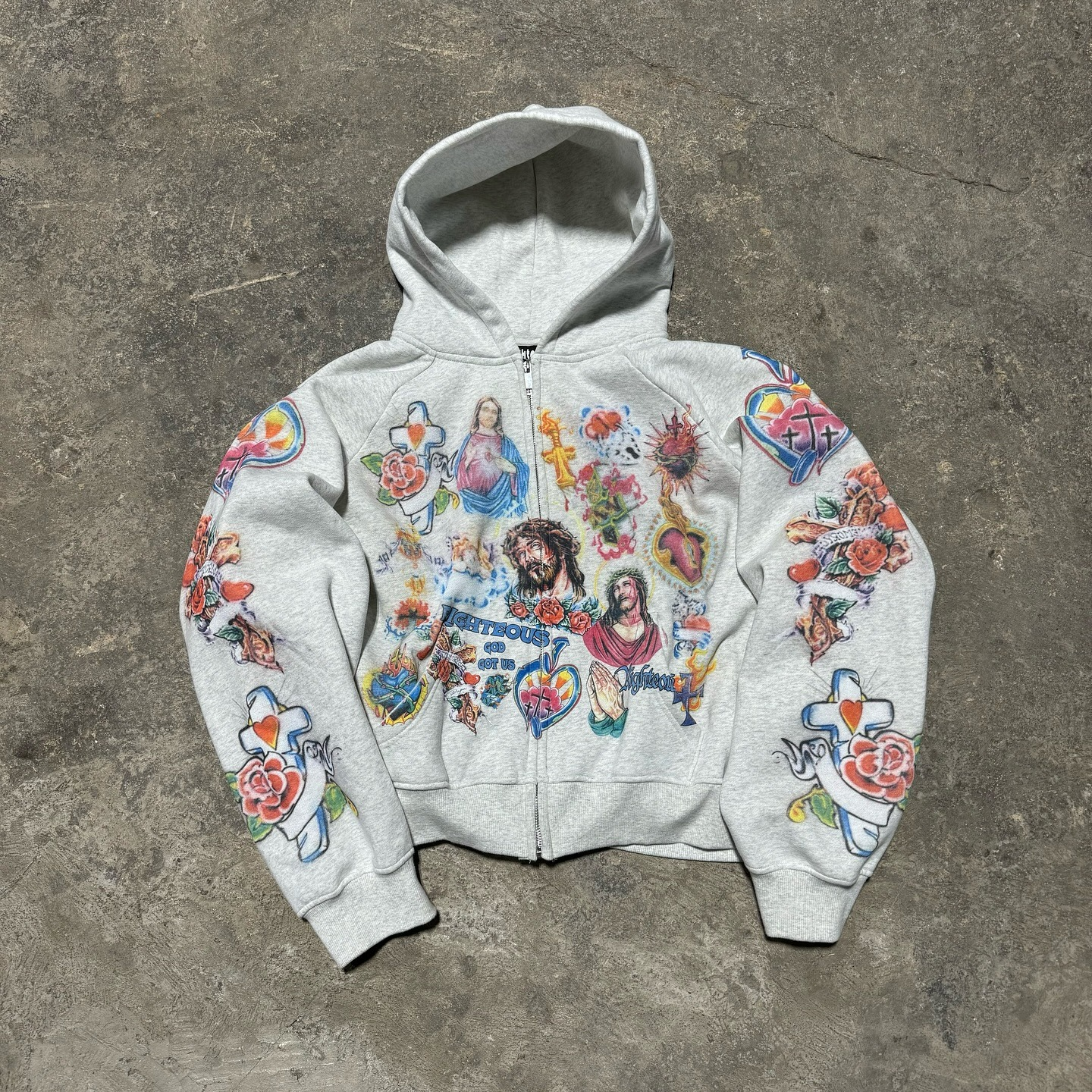 imgi_48_449211437_17989440092668164_899431029377701448_n.webp We Are Righteous The “Risen King” Cropped Zip Up Hoodie White - Image 1